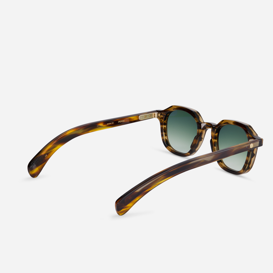 Perse CT-1 offers a Japanese acetate frame in Coyote tortoise color and gradient green lenses for a contemporary look.