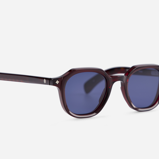 Explore the unique pairing of a Japanese acetate frame in Poison Ivy (deep red) color with solid blue lenses in the Perse PI-1.