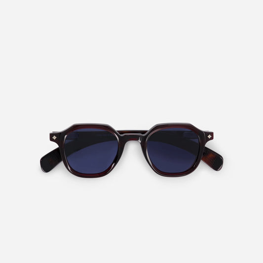 Perse PI-1 showcases a Japanese acetate frame in Poison Ivy (deep red) color, complemented by solid blue lenses.