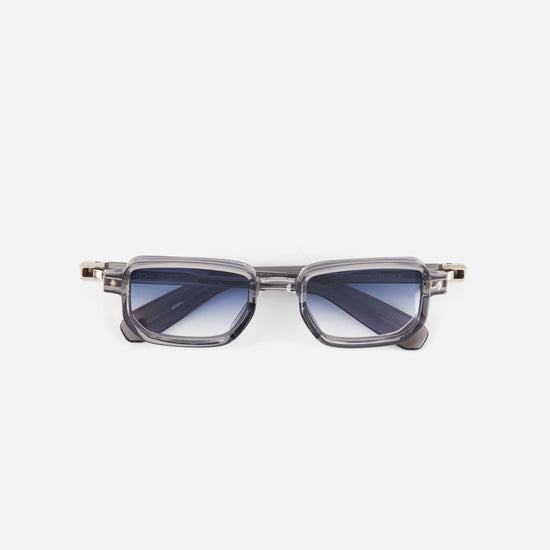 Sunglasses with a gradient blue lens on a white background