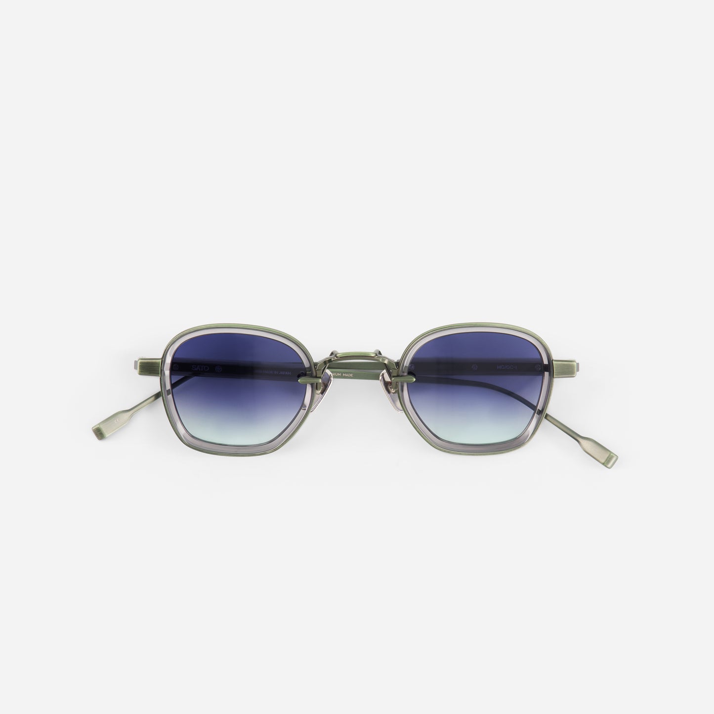 Matt green sunglasses with gradient lenses on a white background