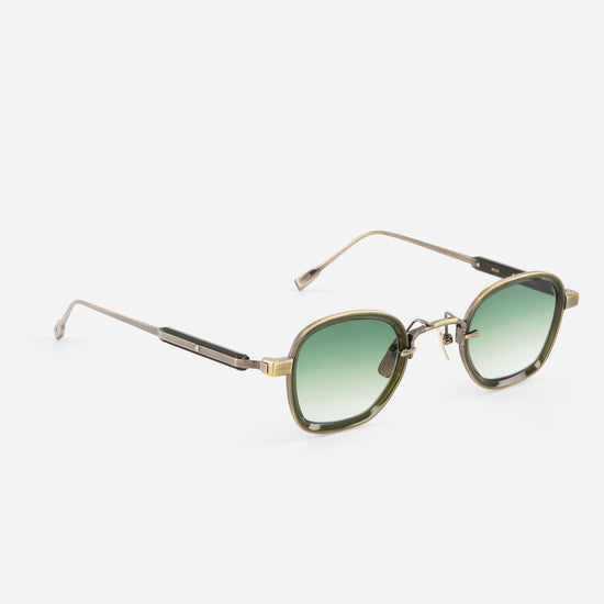 Sunglasses with gold frame and green gradient lenses on a white background