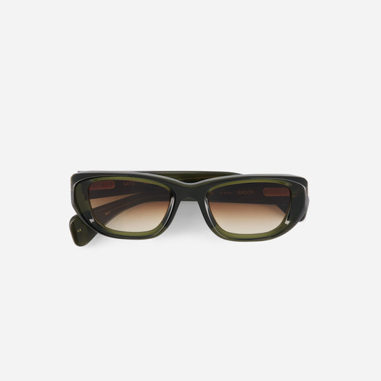 Green sunglasses with a gradient lens on a white background