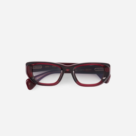 Red-framed eyeglasses on a white background