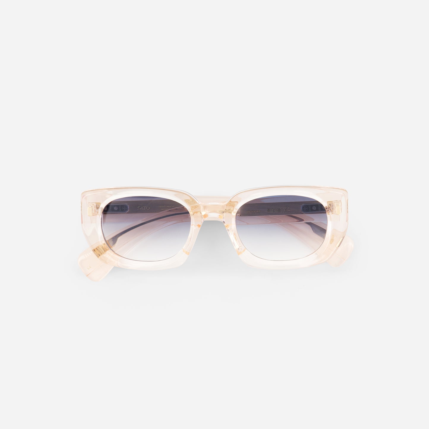 Sunglasses with a light crystal rose frame on a white background