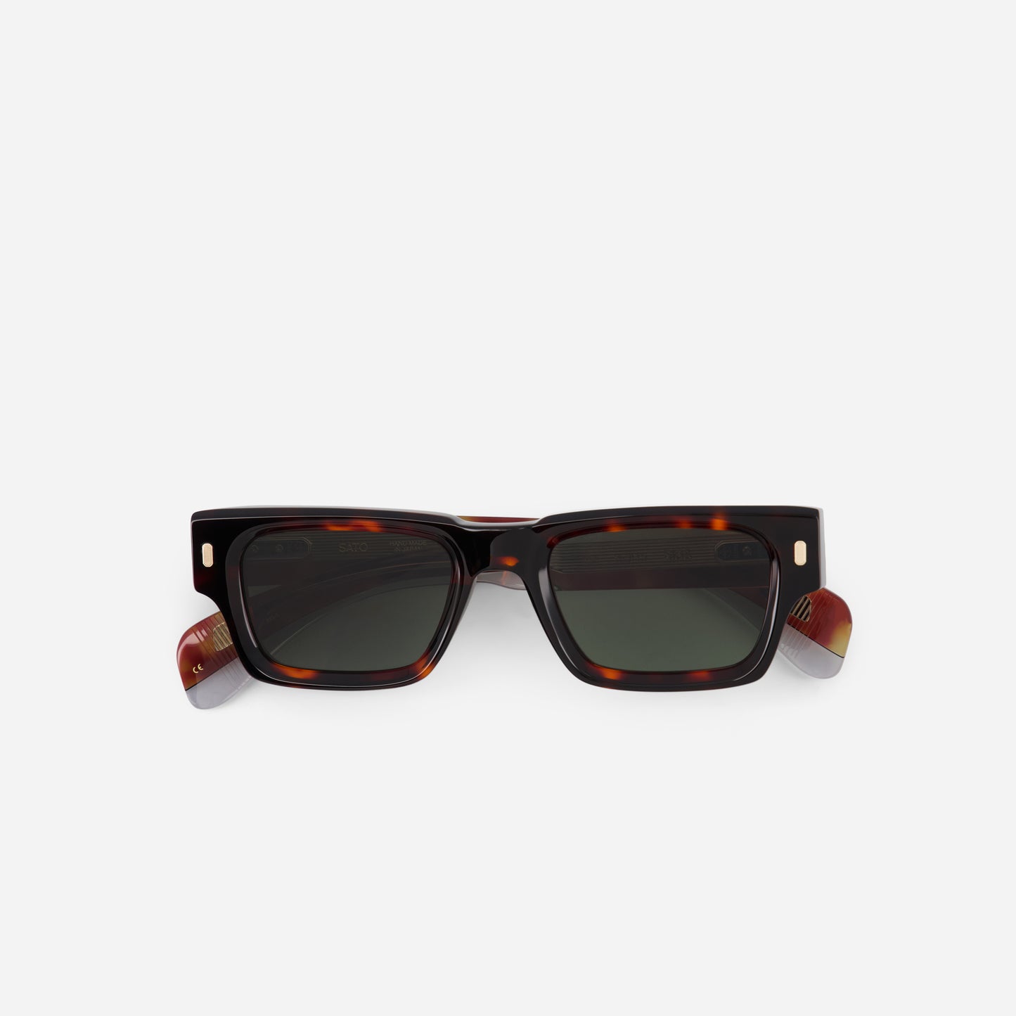 Sunglasses with tortoiseshell frame and dark lenses on a white background