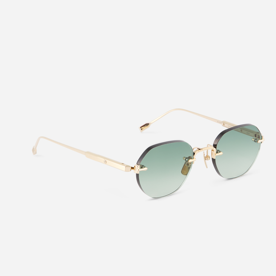 Experience sophistication in every detail with Terebellum Rimless in Lunar Gold and green lenses.