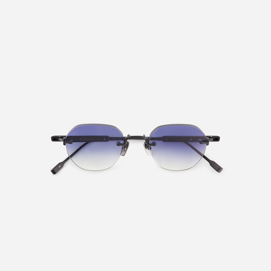  Terebellum 1 S607, a round rimless frame in Titanium with a matte black coating, paired with stunning gradient dark blue lenses