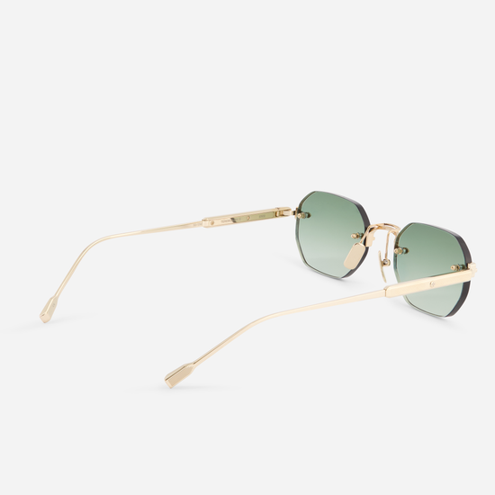 Terebellum II S702, featuring Lunar Gold accents and square rimless design, paired with gradient green lenses.