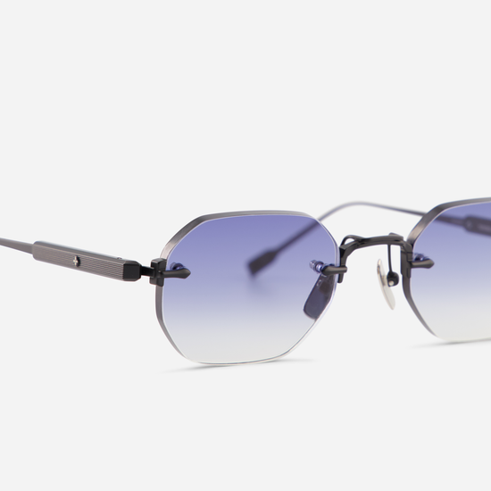 r Titanium frame in matte black, perfectly paired with gradient dark blue lenses. SATO - Terebellum collection