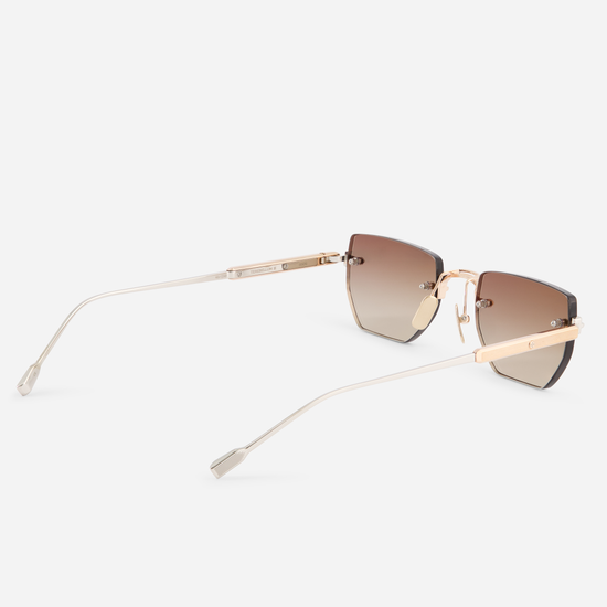 Terebellum III S804, part of the Sato Rimless Collection, boasting a Titanium frame, rose gold & platinum coating, and the allure of gradient brown lenses.