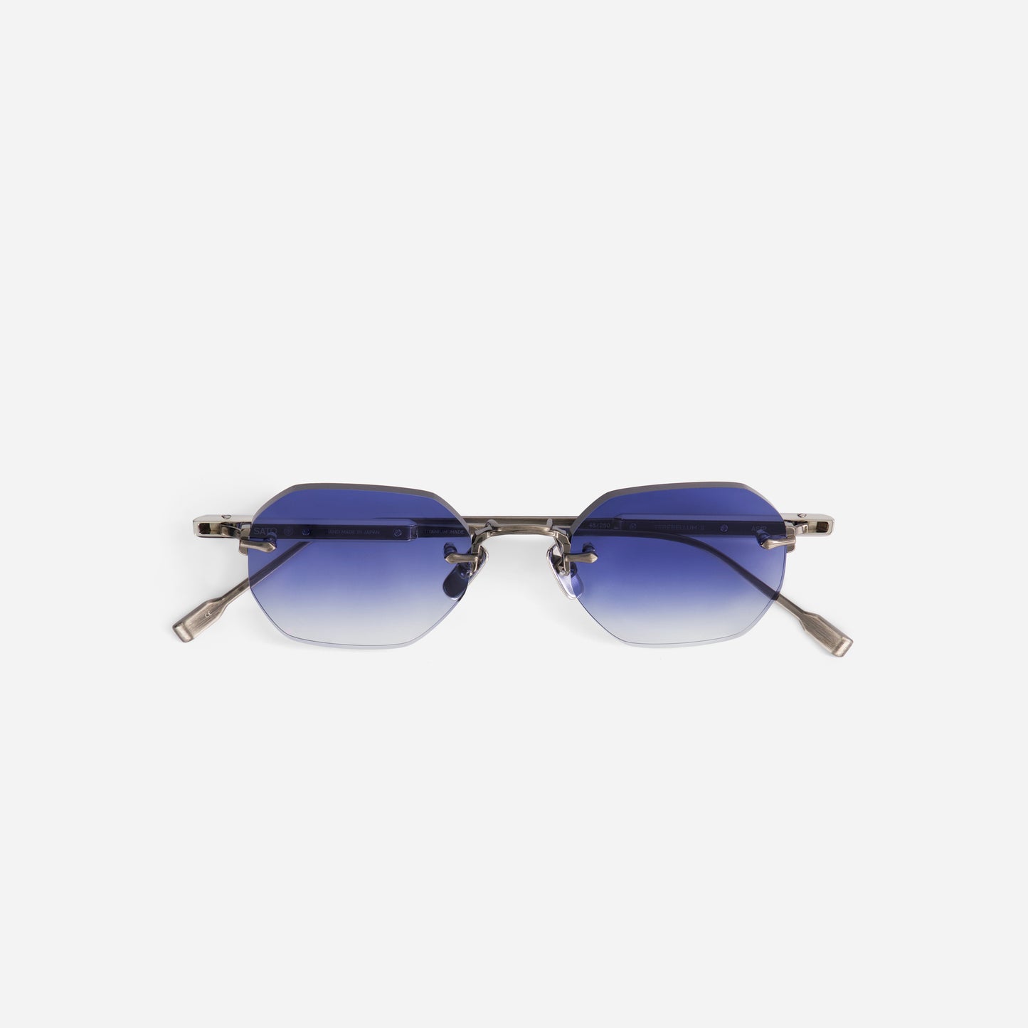Sunglasses with blue gradient lenses and antique silver temples made by sato