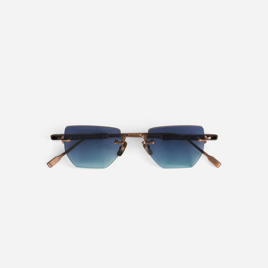 Sunglasses  from terebellum collection with blue gradient lenses and antique bronze temples on a white background