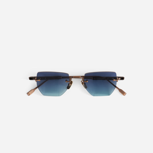 Sunglasses  from terebellum collection with blue gradient lenses and antique bronze temples on a white background