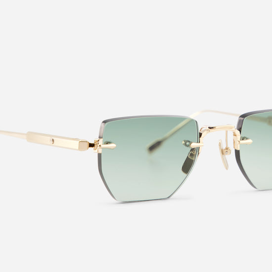 Rimless square sunglasses with light green gradient lenses and gold titanium frames, shown on a light gray background.