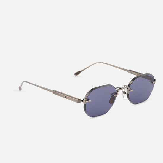 square rimless sunglasses with a silver-tone titanium frame and BL16 blue-gray tinted lenses, shown on a light gray background.