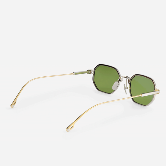  Timir S502 hexagonal glasses, flawlessly crafted from luxurious Japanese titanium in the Yellow Gold and Platinum finishes, paired with exquisite green lenses.