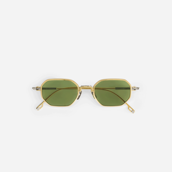 Timir S502 hexagonal glasses, meticulously crafted from pure Japanese titanium in the elegant Yellow Gold and Platinum colors, featuring captivating green lenses.