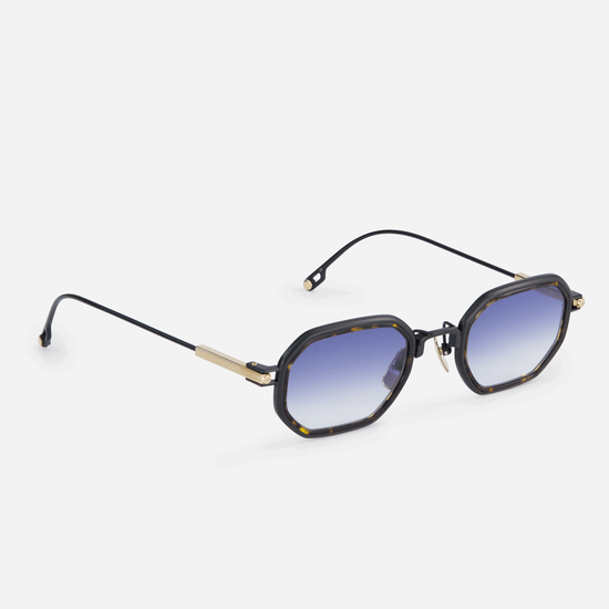 Timir-T S5506 glasses, showcasing the perfect blend of pure black gold and lunar gold titanium frames, a trendy tortoise Takiron insert, and dark blue gradient lenses.