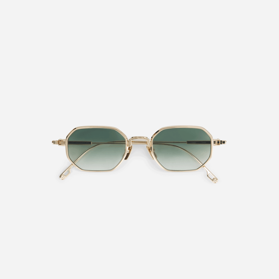 Timir S502, exquisitely crafted hexagonal glasses made from pure Japanese titanium in the captivating Lunar Gold color, complemented by stunning olive gradient lenses.