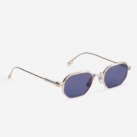 Timir S504 hexagonal glasses from the Sato SS23 collection. These stunning glasses, crafted from pure Japanese titanium in Rose Gold and Platinum, feature captivating blue-tinted lenses, making them a must-have accessory for fashion-forward men and women.