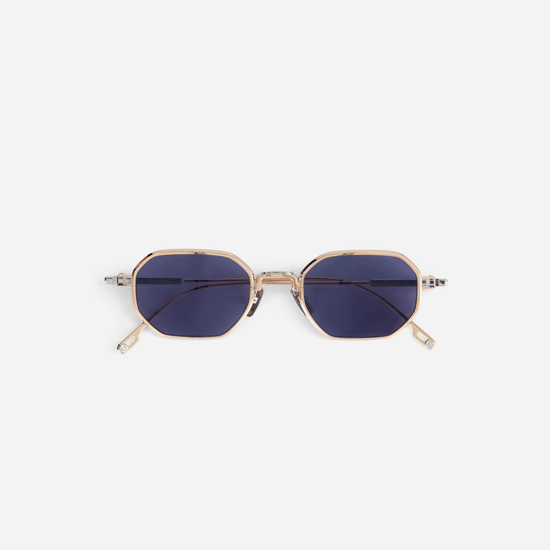 Timir S504 hexagonal glasses from the new Sato SS23 collection. These exquisite glasses, made from pure Japanese titanium in Rose Gold and Platinum colors, feature trendy blue-tinted lenses for both men and women.