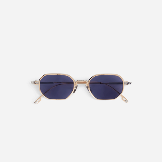 Timir S504 hexagonal glasses from the new Sato SS23 collection. These exquisite glasses, made from pure Japanese titanium in Rose Gold and Platinum colors, feature trendy blue-tinted lenses for both men and women.