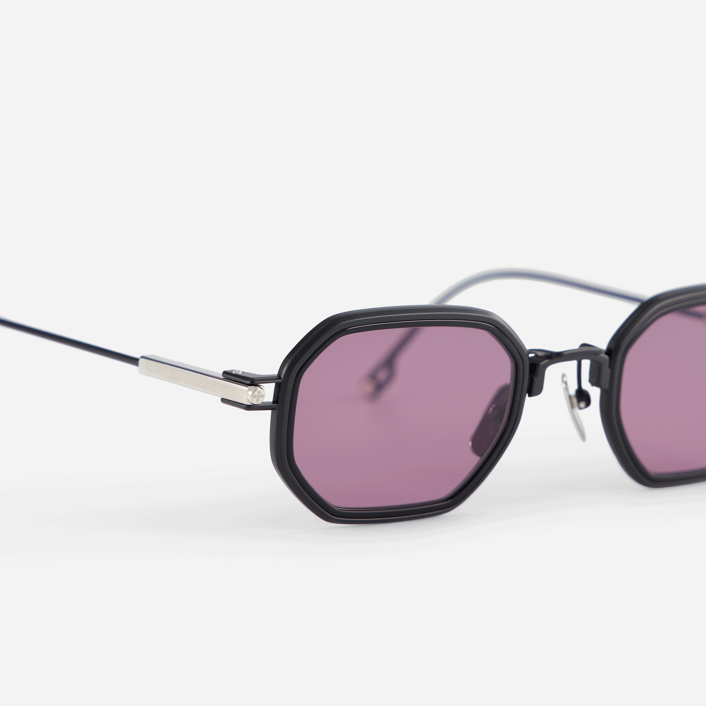 Timir-T S5505 glasses, showcasing the perfect combination of pure black and platinum titanium frames, a chic black Takiron insert, and violet lenses.