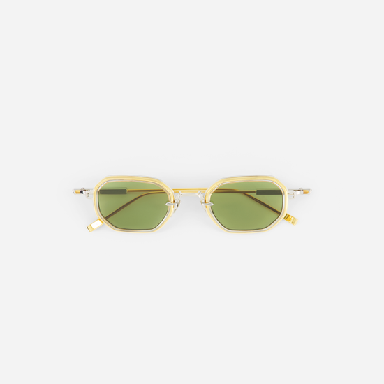 Gold-framed sunglasses with green lenses on a white background