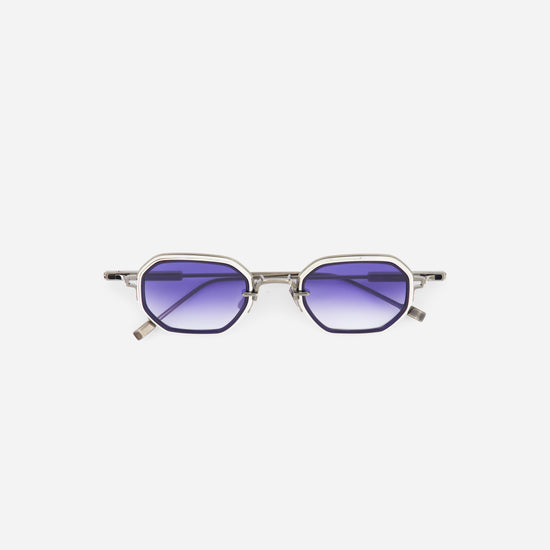 Platinum sunglasses with purple blue graduent lenses on a white background