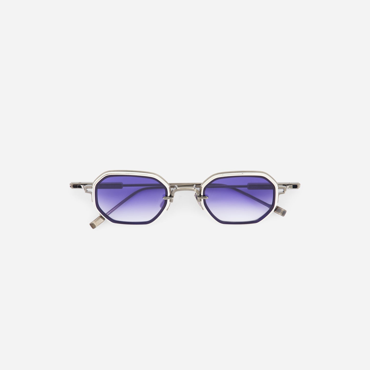 Platinum sunglasses with purple blue graduent lenses on a white background