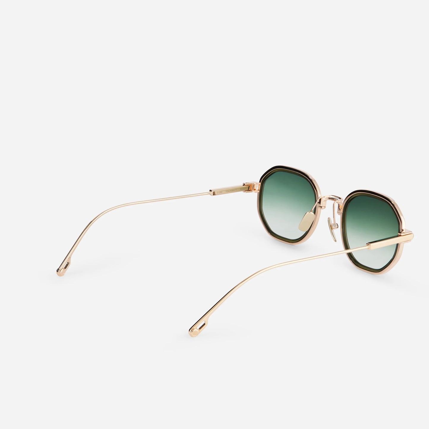 Step into the world of luxury with Toliman-T S3309 hexagonal sunglasses. Expertly crafted in pure rose gold titanium, these eyewear pieces feature green gradient lenses and an exquisite olive green insert.