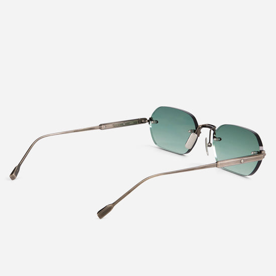 The Terebellum IV S1008 combines a sleek rectangular frame with antique silver branches and light turquoise gradient lenses.