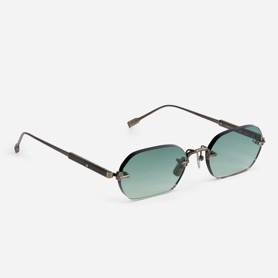 Terebellum IV S1008 showcases a rectangular rimless frame with antique silver temples and soft turquoise gradient lenses, providing a contemporary touch.