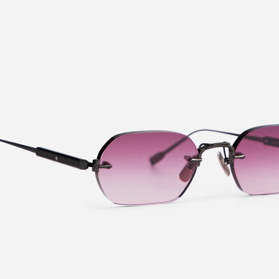 With its brushed black finish and rectangular frame, the Terebellum IV S1010 sunglasses evoke a retro 90s aesthetic, complemented by pink gradient lenses.