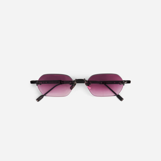 Terebellum IV S1010 sunglasses feature a rectangular rimless design in brushed black with pink gradient lenses, channeling 90s-inspired style.