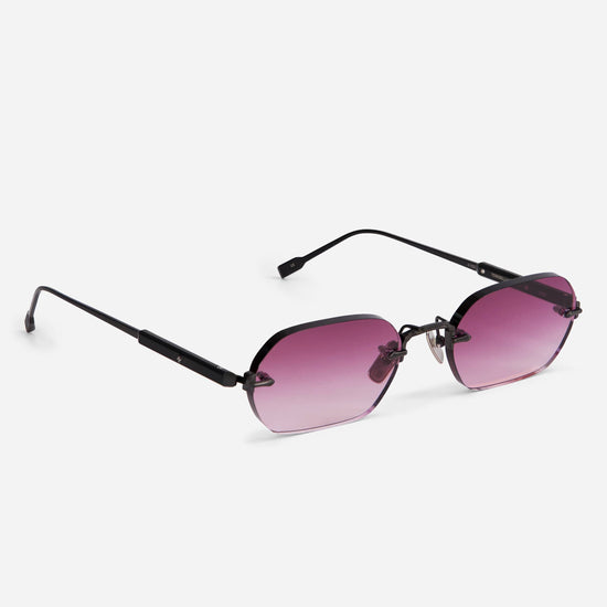 The Terebellum IV S1010 combines a brushed black frame with soft pink gradient lenses, offering a bold rectangular design with 90s flair.