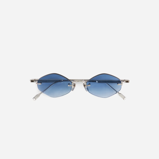 Terebellum V S1201 sunglasses in platinum feature a rimless design with blue gradient lenses, creating a sleek and contemporary look.