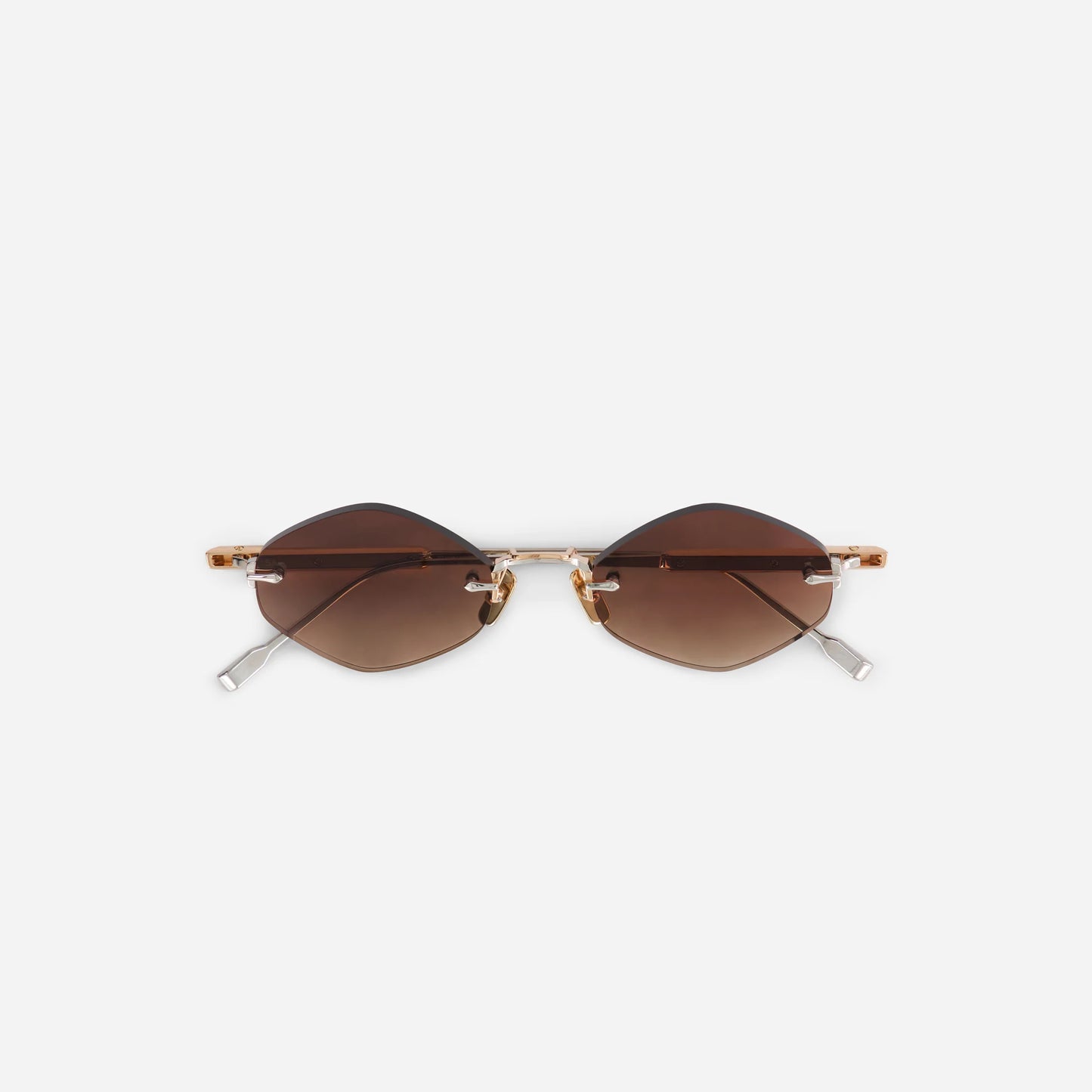 Terebellum V S1204 sunglasses feature a striking triangular shape, with a rimless rose gold and platinum frame and brown gradient lenses.