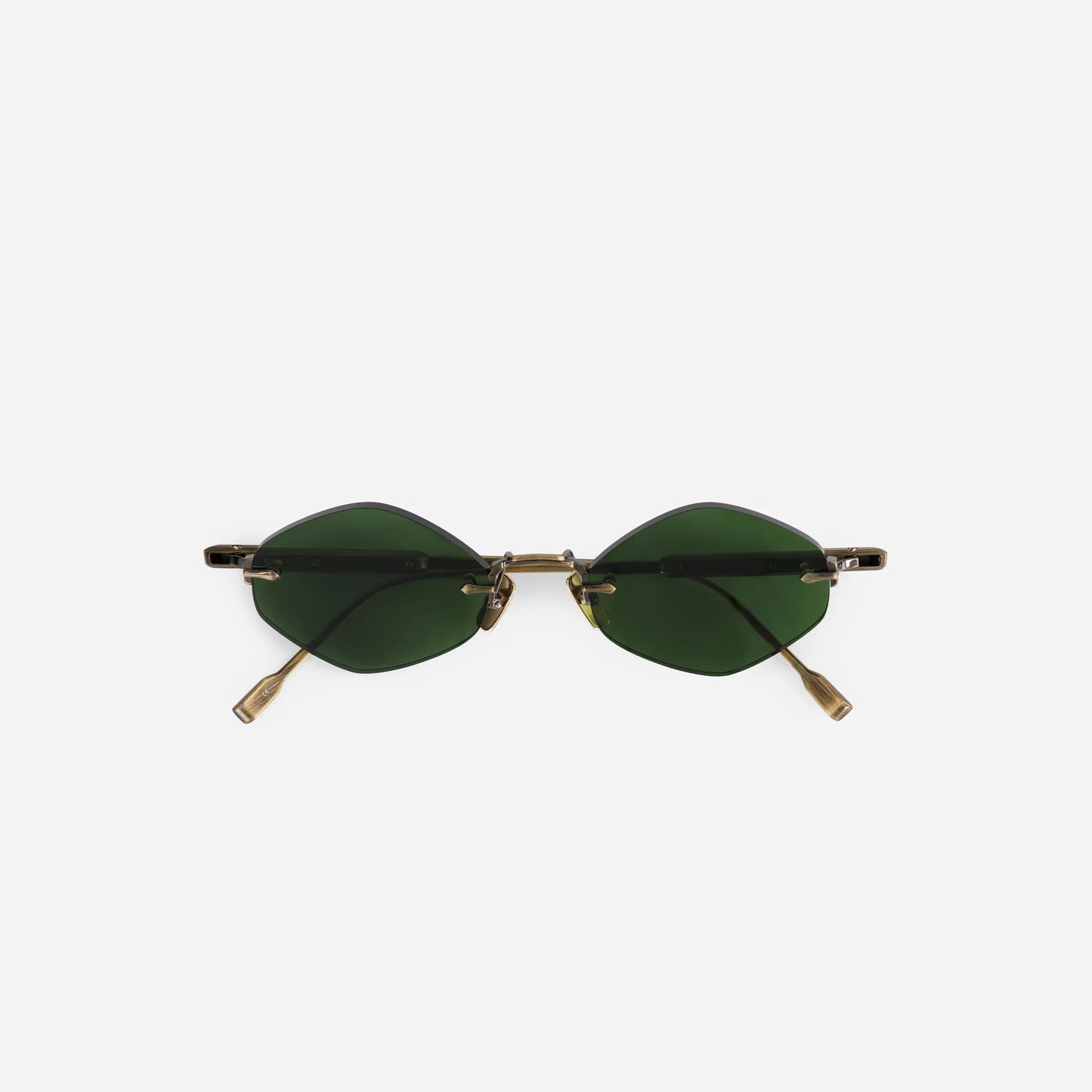 Terebellum V S1209 sunglasses in antique gold feature a rimless design with dark green lenses, offering a 90s-inspired aesthetic.