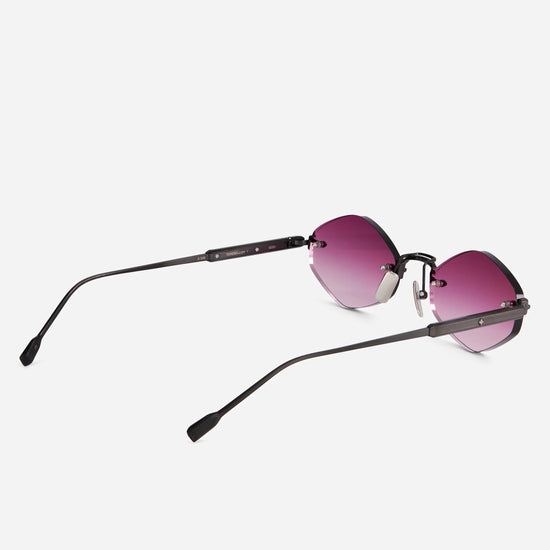 With its brushed black frame and delicate pink gradient lenses, the Terebellum V 1210 sunglasses create a bold yet subtle rimless design.