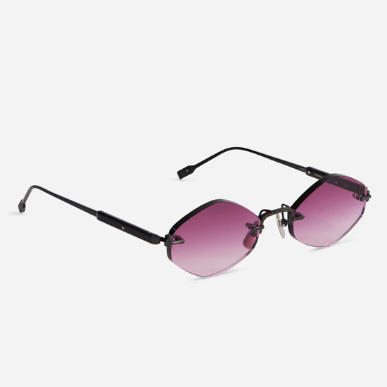 The Terebellum V 1210 combines a brushed black frame with elegant pink gradient lenses, offering a sophisticated rimless style.