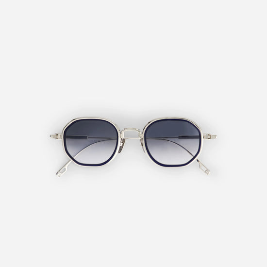Toliman-T S3301 sunglasses crafted from pure silver titanium, featuring gray gradient lenses and a captivating midnight blue insert.