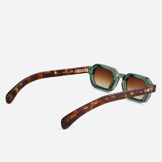 Vega VI-1 combines green and tortoise patterns with silver detailing and brown gradient lenses.