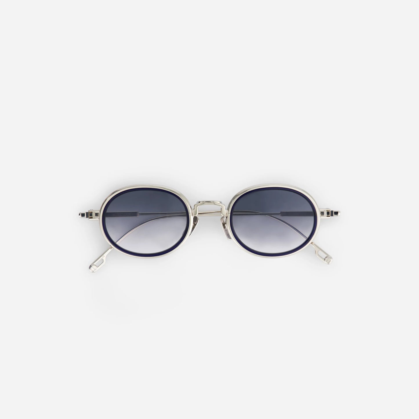 Sato unisex sunglasses with a silver titanium frame and gradient silver grey lenses