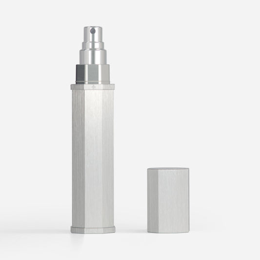 Silver spray bottle on a white background