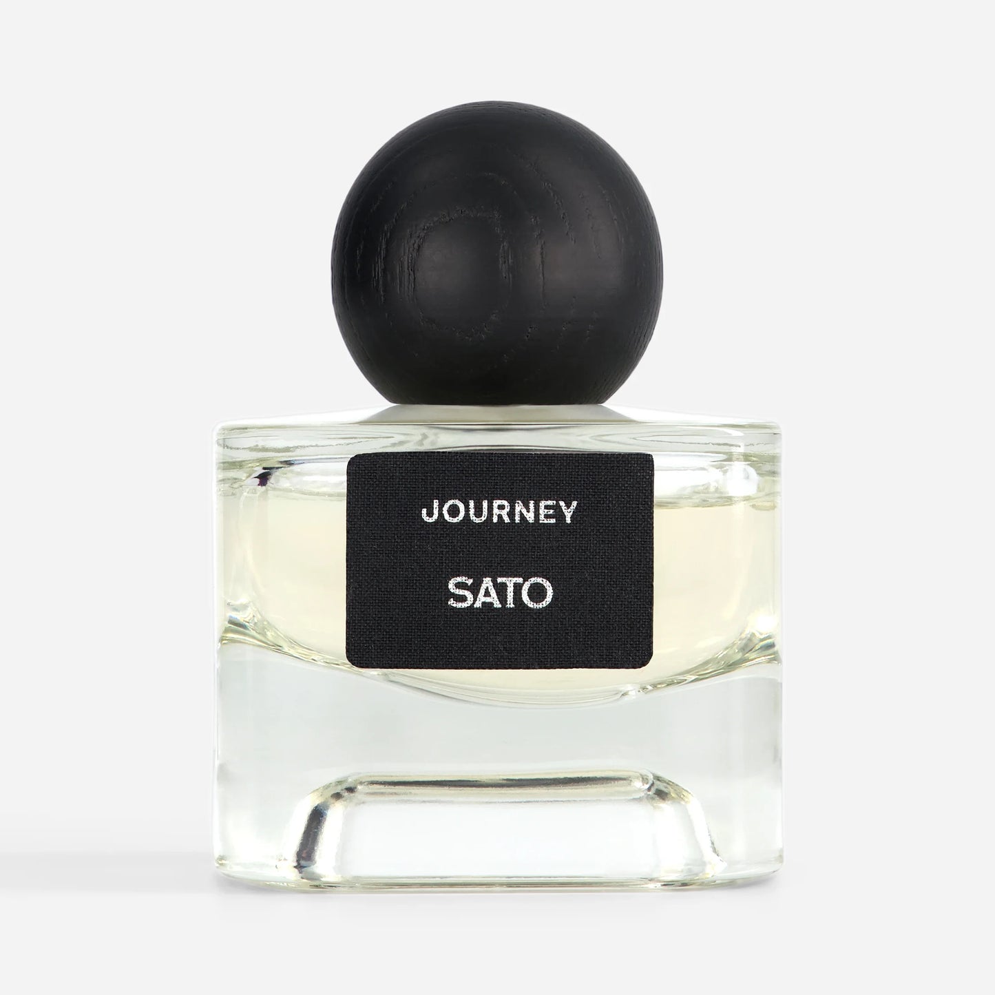 Perfume bottle labeled 'Journey Sato' with a black cap on a white background