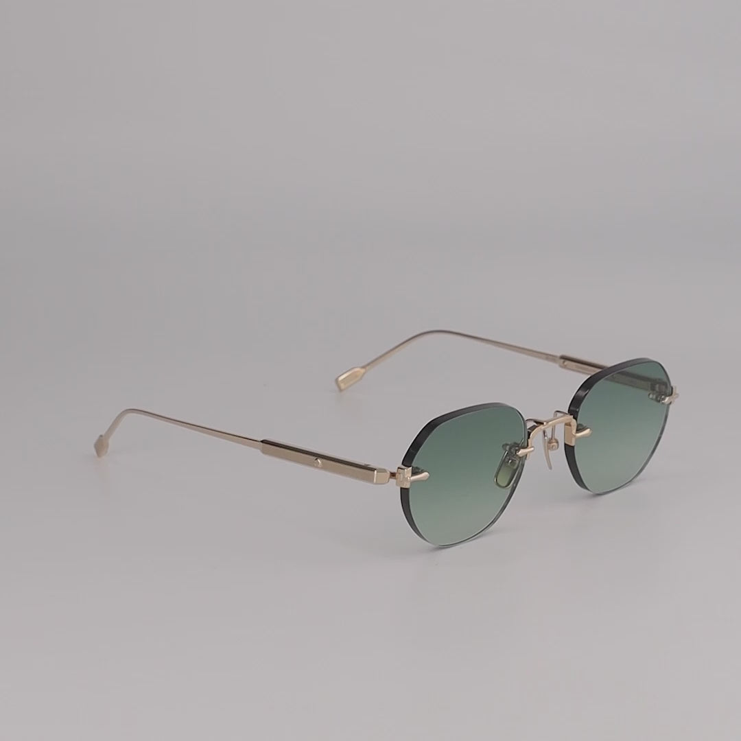 Terebellum I S602 Rimless Sunglasses in Lunar Gold and vibrant green lenses.